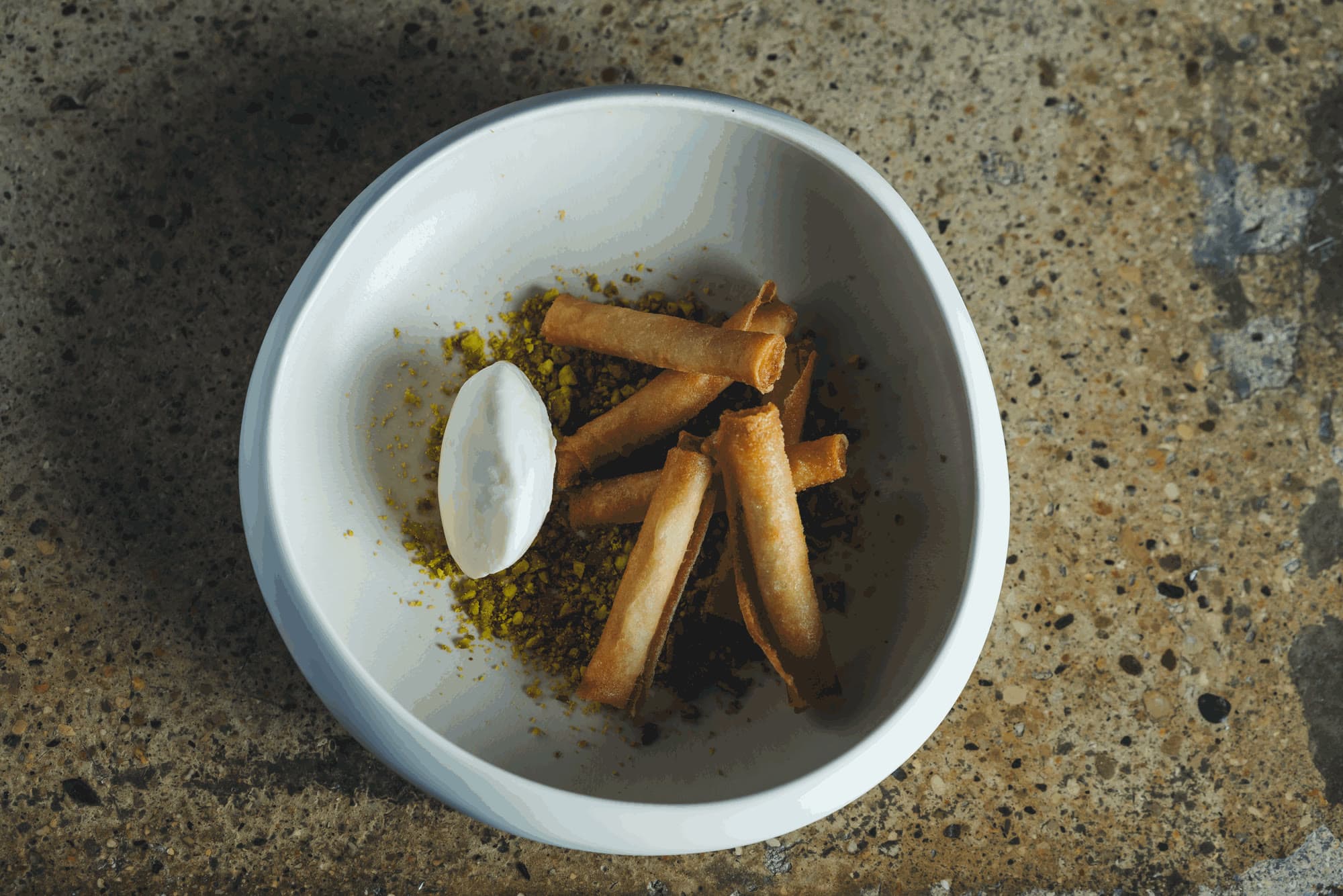 Crispy cigars, crushed pistachios and an iced quenelle
