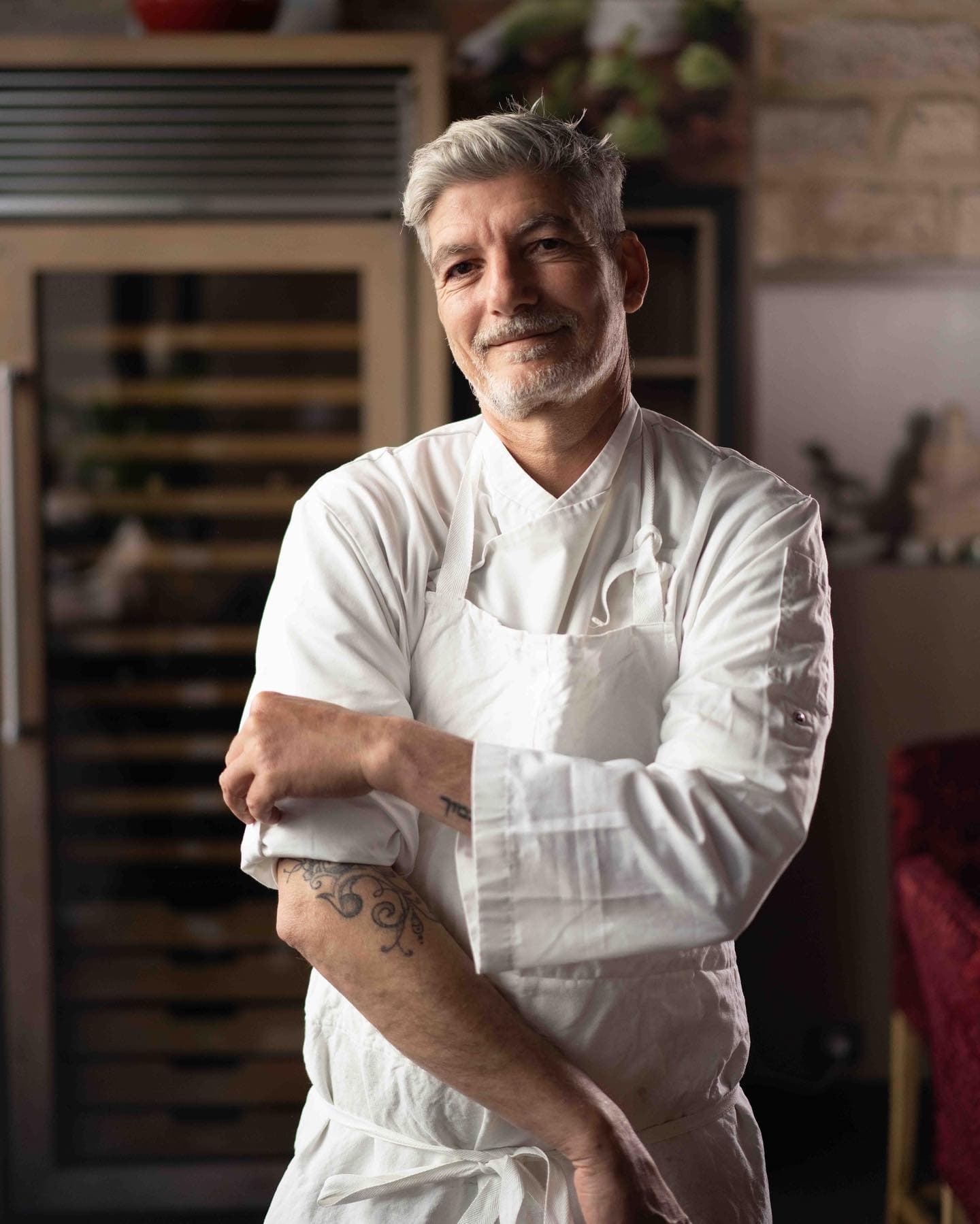 Ohad Amzallag in his chef’s jacket, in his kitchen